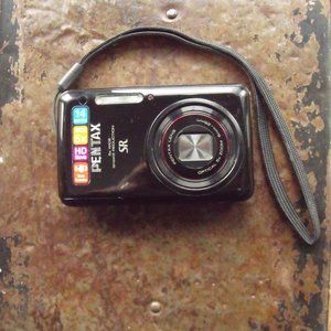 Pentax Optio S1 14 MP Digital Camera with 5X Optical Zoom, 2.7-inch LCD